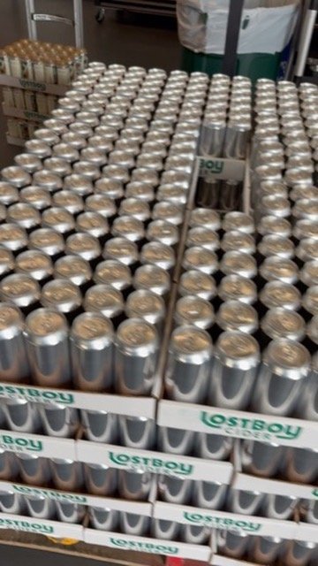 Cases of Lost Boy cider cans